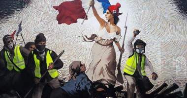 Imagem da matéria: Artista de rua esconde mil dólares em Bitcoin dentro de mural sobre protestos em Paris