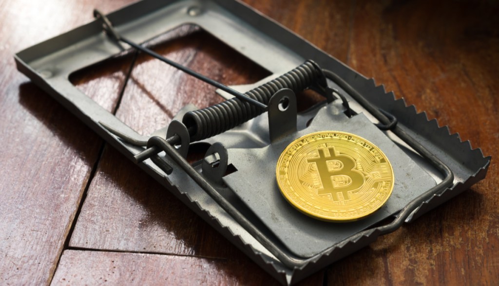 Ratoeira com moeda de bitcoin