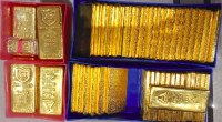 várias barras de ouro dentro de copartimento