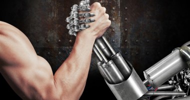 braço de ferro entre uma mão humana e uma robótica