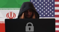 Mulher com capuz opera um computador à frente das bandeiras dos EUA e Irã