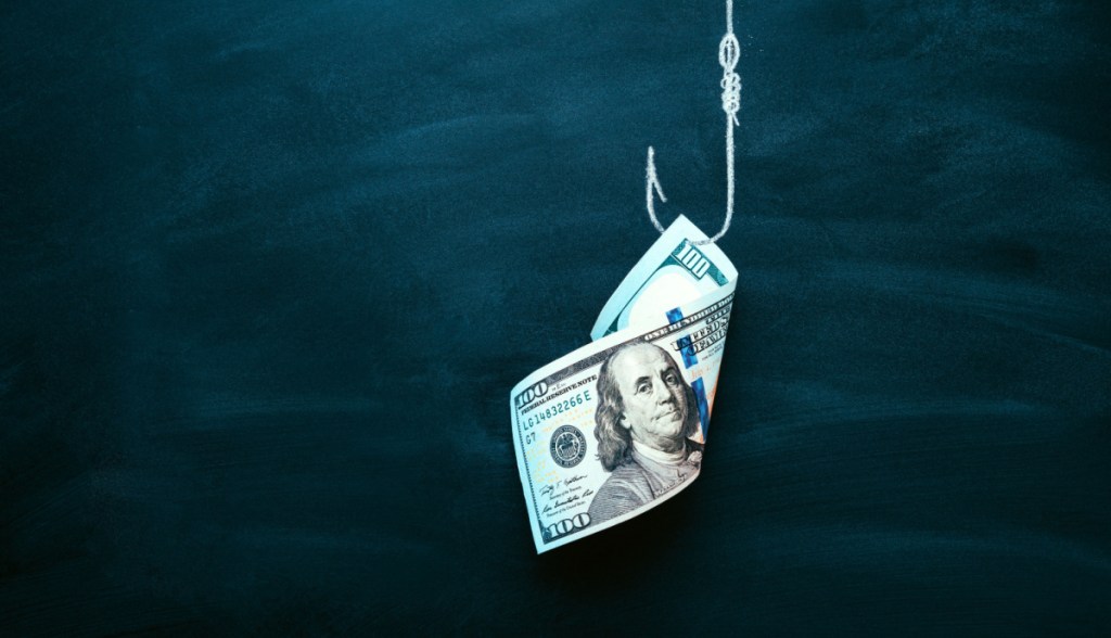 Anzol com uma nota de dinheiro como isca