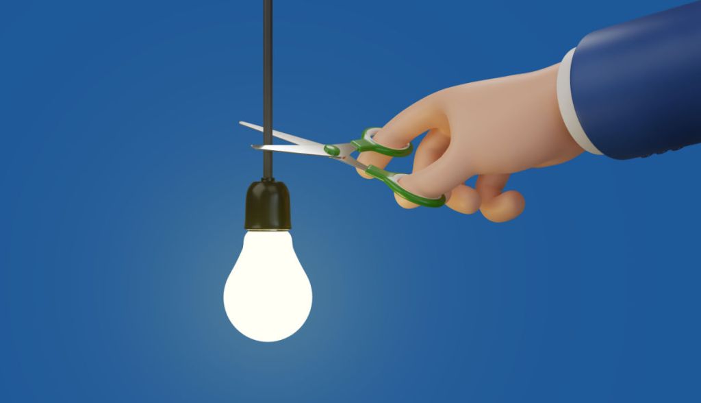 Desenho de uma tesoura cortando o fio de energia e uma lâmpada