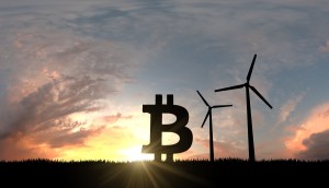 Símbolo do Bitcoin à altura de cataventos no topo de um morro à frente da luz do Sol