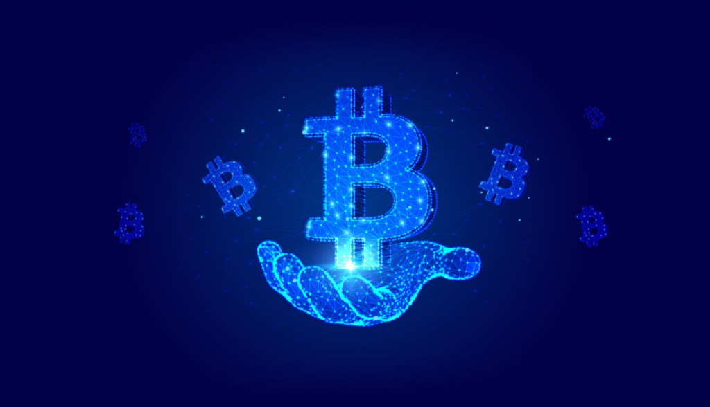 simbolo de bitcoin flutuando em mão digital