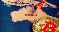 Moeda de bitcoin ao lado de mapa da Austrália